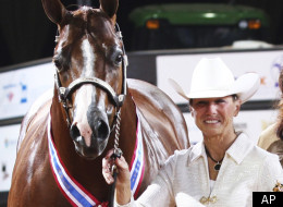 This November 2011 file photo, provided by The American Quarter Horse Journal shows Rita Crundwell, of Dixon, Ill., posing with her horse, Pizzazzy Lady, at the 2011 American Quarter Horse Association World Championship Show in Oklahoma City.