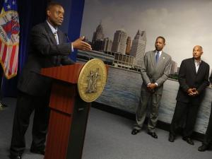 Detroit Emergency Financial Manager Kevyn Orr, left, announces that he filed for municipal bankruptcy during a news conference at the Coleman A. Young municipal building in Detroit on July 18, 2013. (Photo: Romain Blanquart, Detroit Free Press)